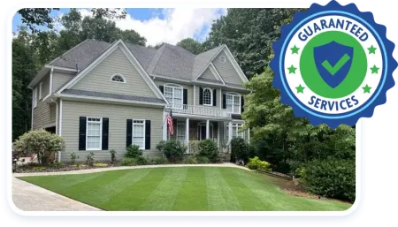 guaranteed services badge, house with green lawn
