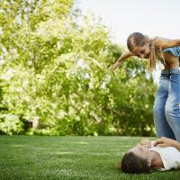 Mother and daughter playing in the yard