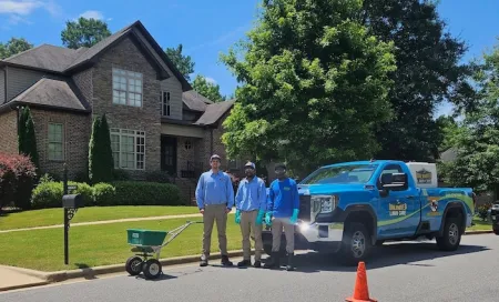 techs standing infront of truck